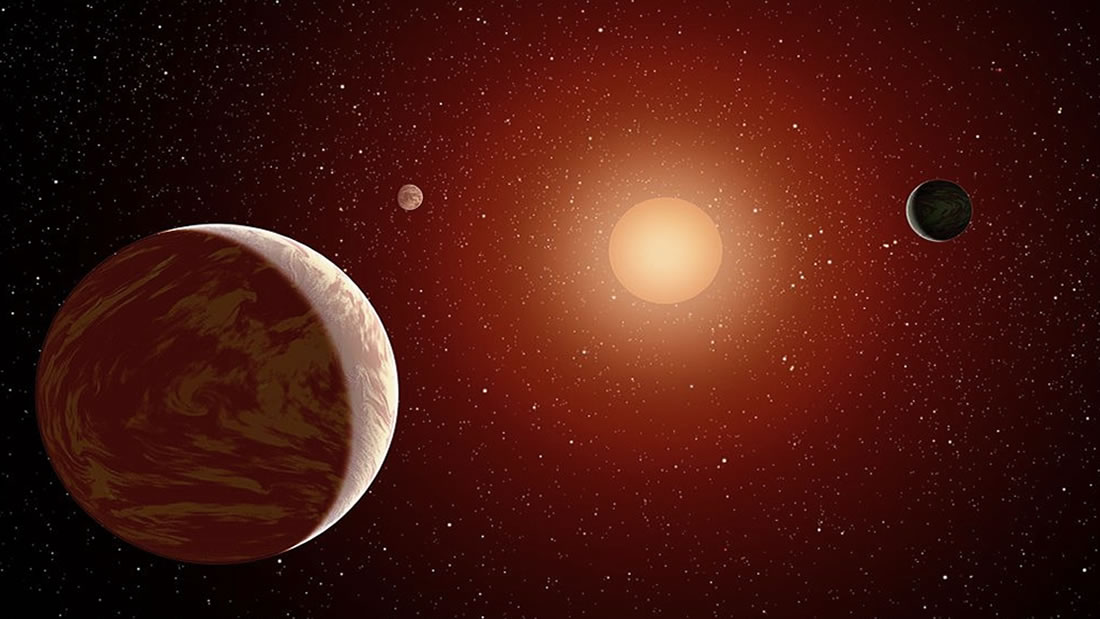 Concepto artístico de una joven estrella enana roja rodeada de tres planetas